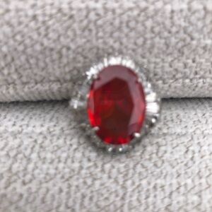 Red Oval Cocktail Ring with Clear Halo Accent